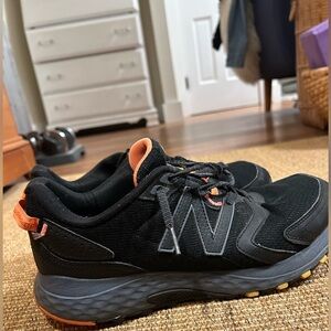 New Balance Men's Black and Orange Trail Shoes with inserts